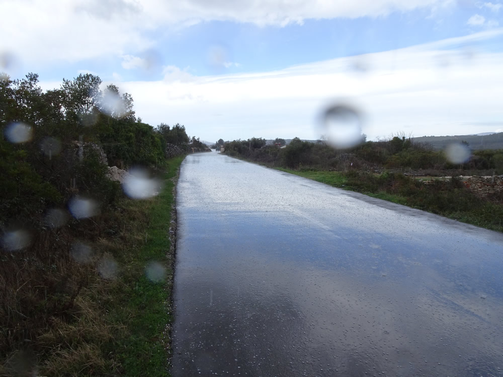 Sky reflected off the wet road
